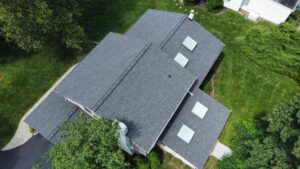 A drone shot of a new asphalt roof in bucks county pa