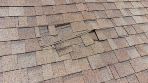 overlapping shingles are a roof are warping and not laying flat