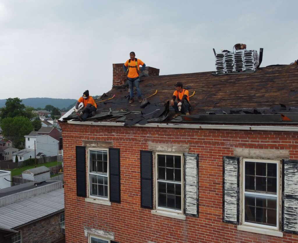 our top home improvement experts work on a roof