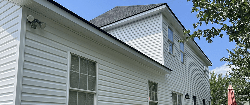 white siding on a home for the siding replacement signs blog