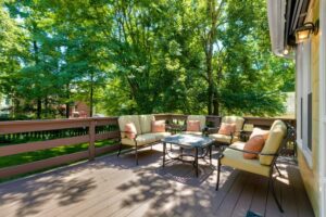 A deck with patio furniture on a sunny day