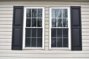 Windows with black shutters