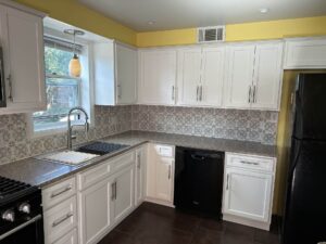 Kitchen remodel with gray tile and yellow walls